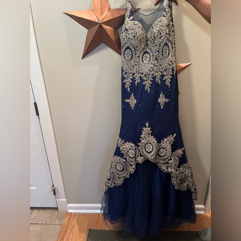 Blue mermaid style prom dress with gold detailing from Anny Lee.